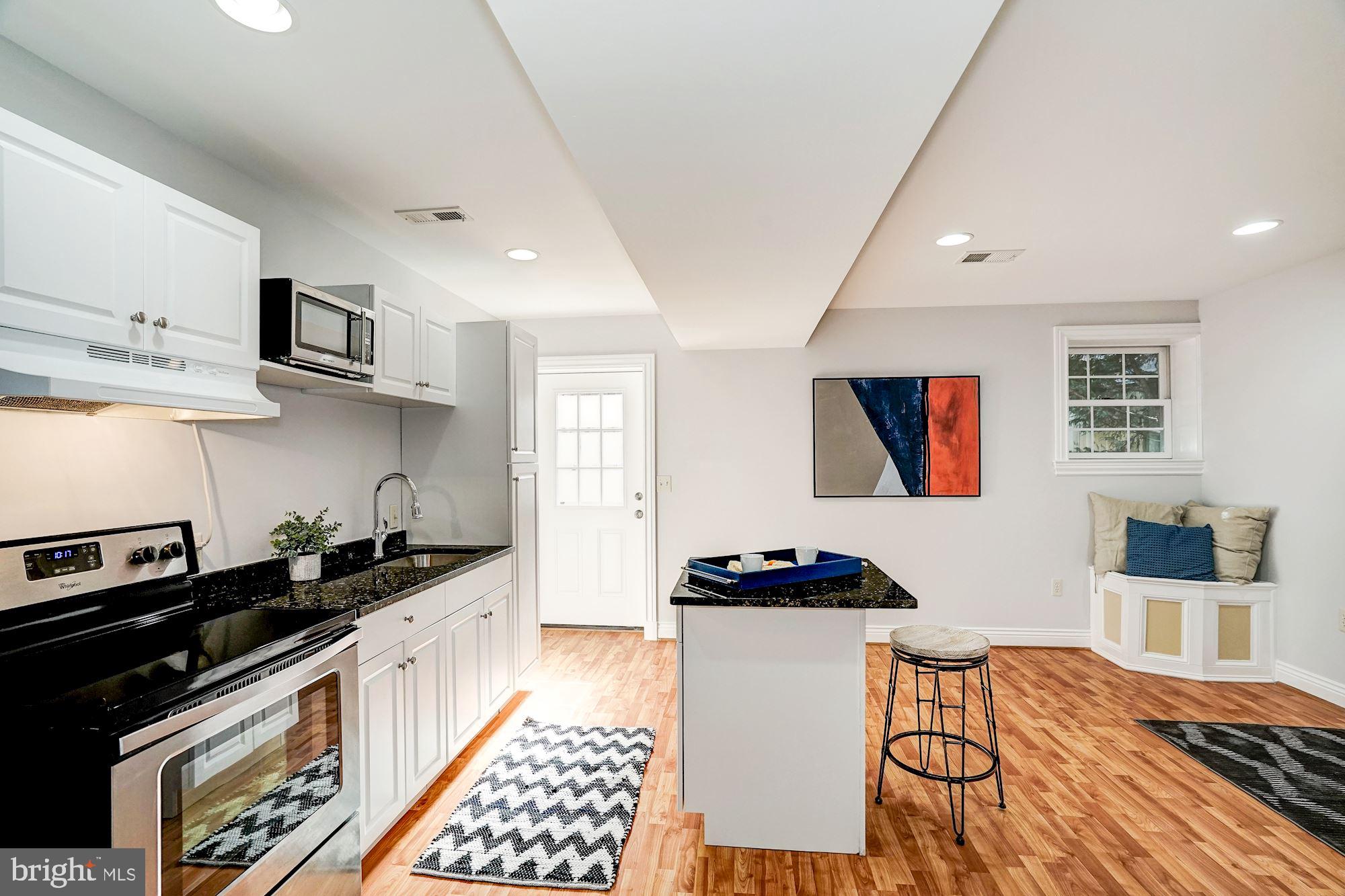 3 Sunset Drive Alexandria, VA 22301 - Photo 25 of 47 a kitchen with stainless steel appliances a stove a sink a refrigerator and cabinets