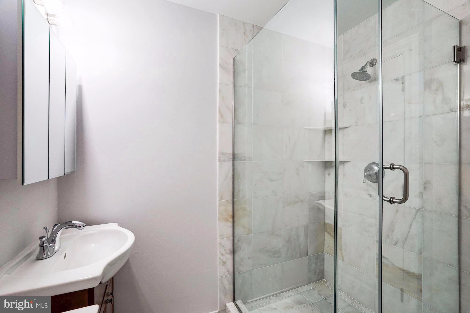 3 Sunset Drive Alexandria, VA 22301 - Photo 30 of 47 a bathroom with a shower and a sink