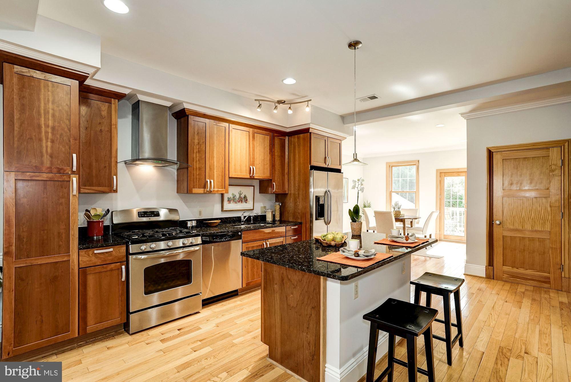 3 Sunset Drive Alexandria, VA 22301 - Photo 7 of 47 a kitchen with stainless steel appliances granite countertop a stove refrigerator sink and cabinets