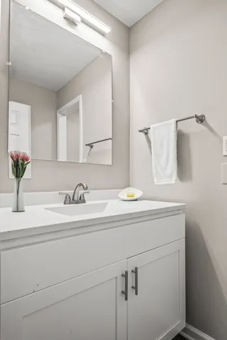 a bathroom with a sink and a mirror