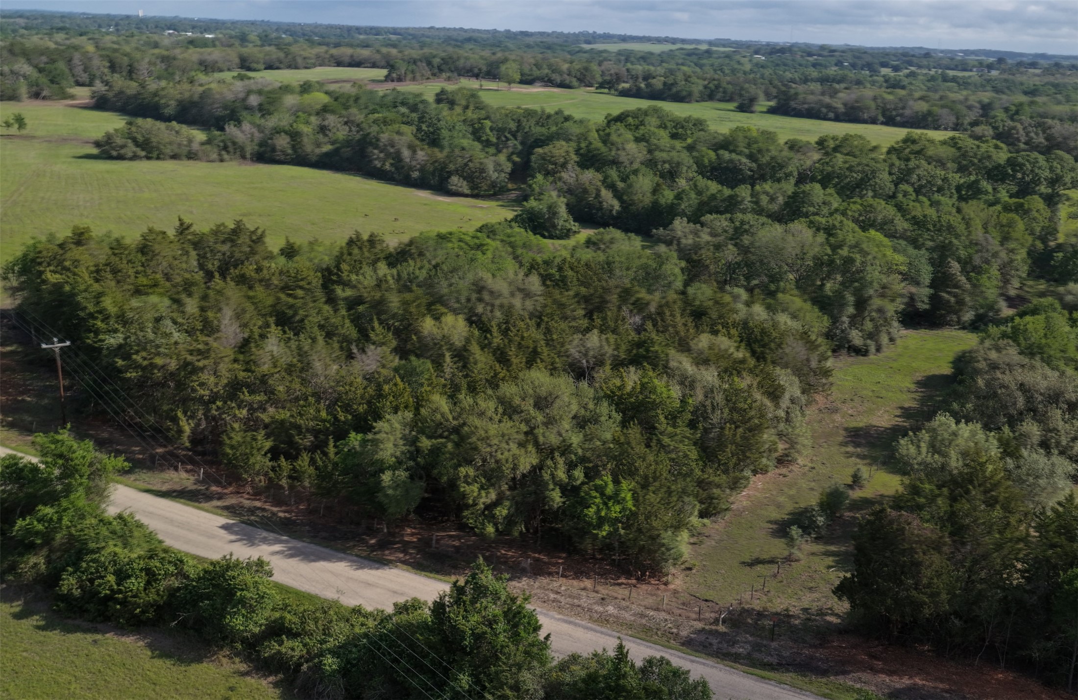 an aerial view of mountains with green space