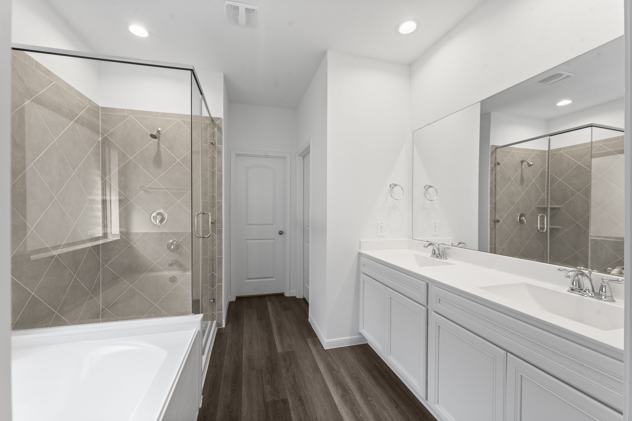 544 Newcomb Hollow Drive Conroe, TX 77304 - Photo 16 of 31 Beautiful primary bathroom with dual sinks, soaking tub and glass enclosed shower.