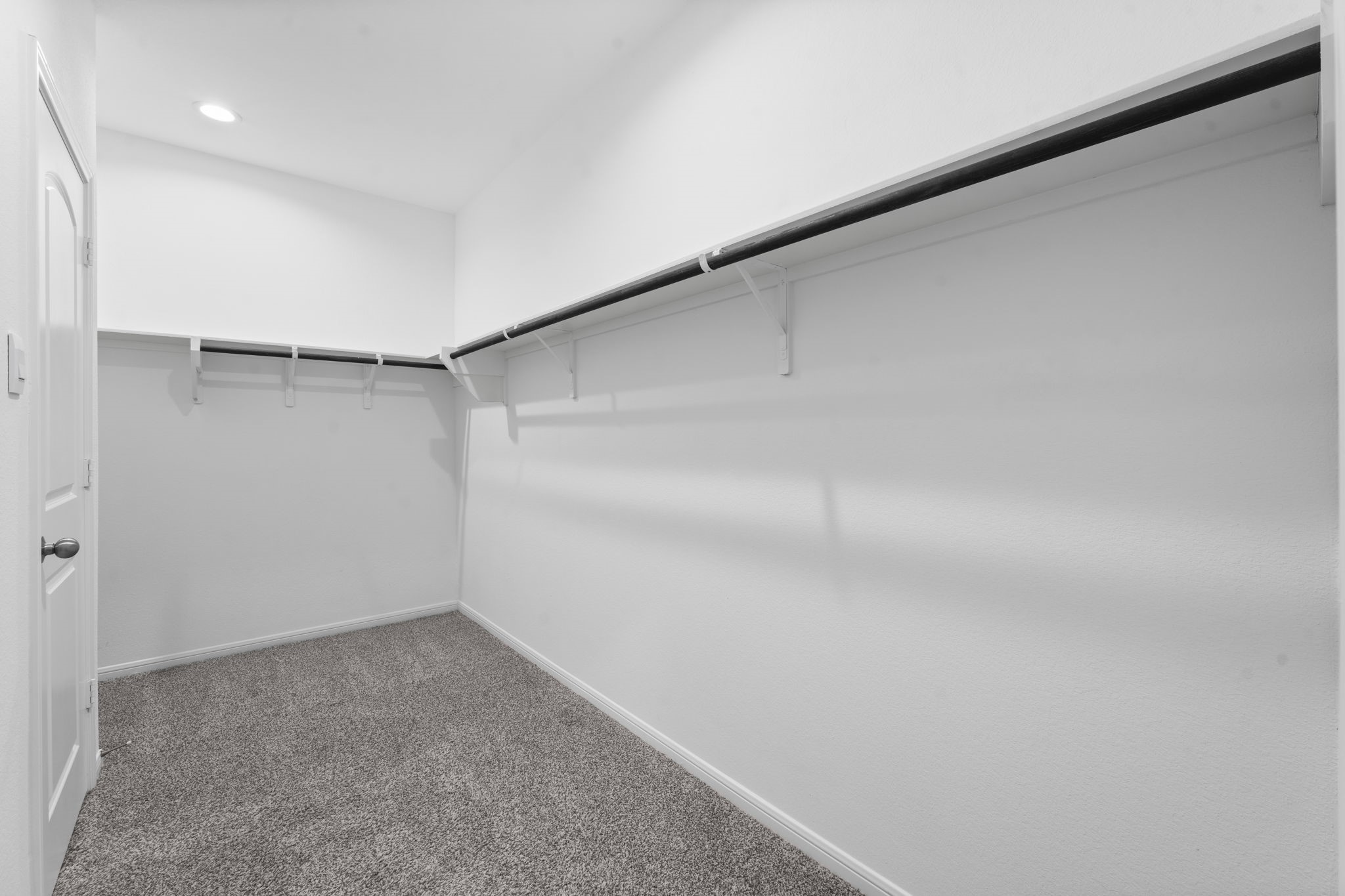 544 Newcomb Hollow Drive Conroe, TX 77304 - Photo 19 of 31 Spacious walk-in primary closet with convenient access to the laundry room.