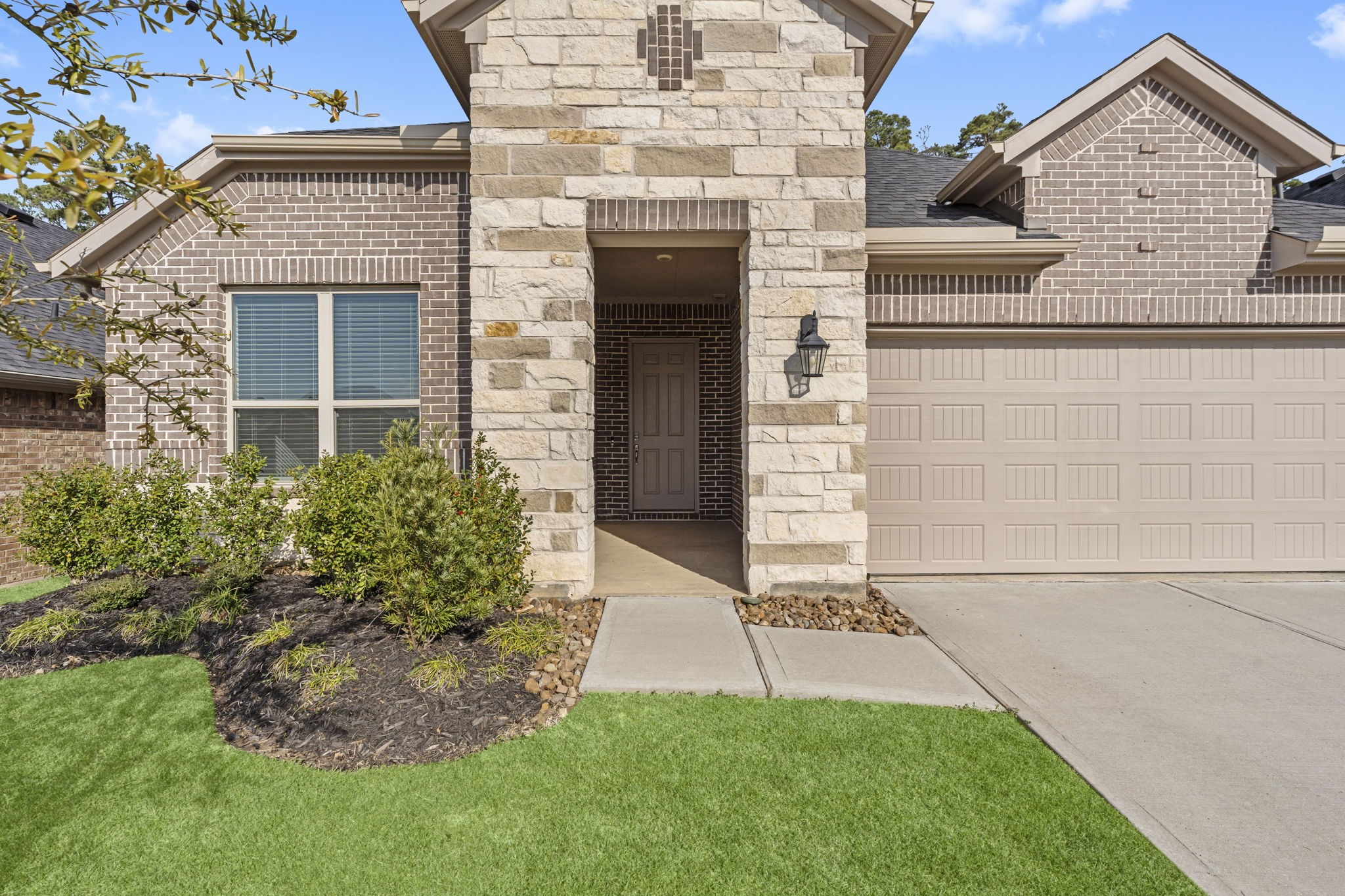 544 Newcomb Hollow Drive Conroe, TX 77304 - Photo 2 of 31 Beautiful stone and brick one-story.