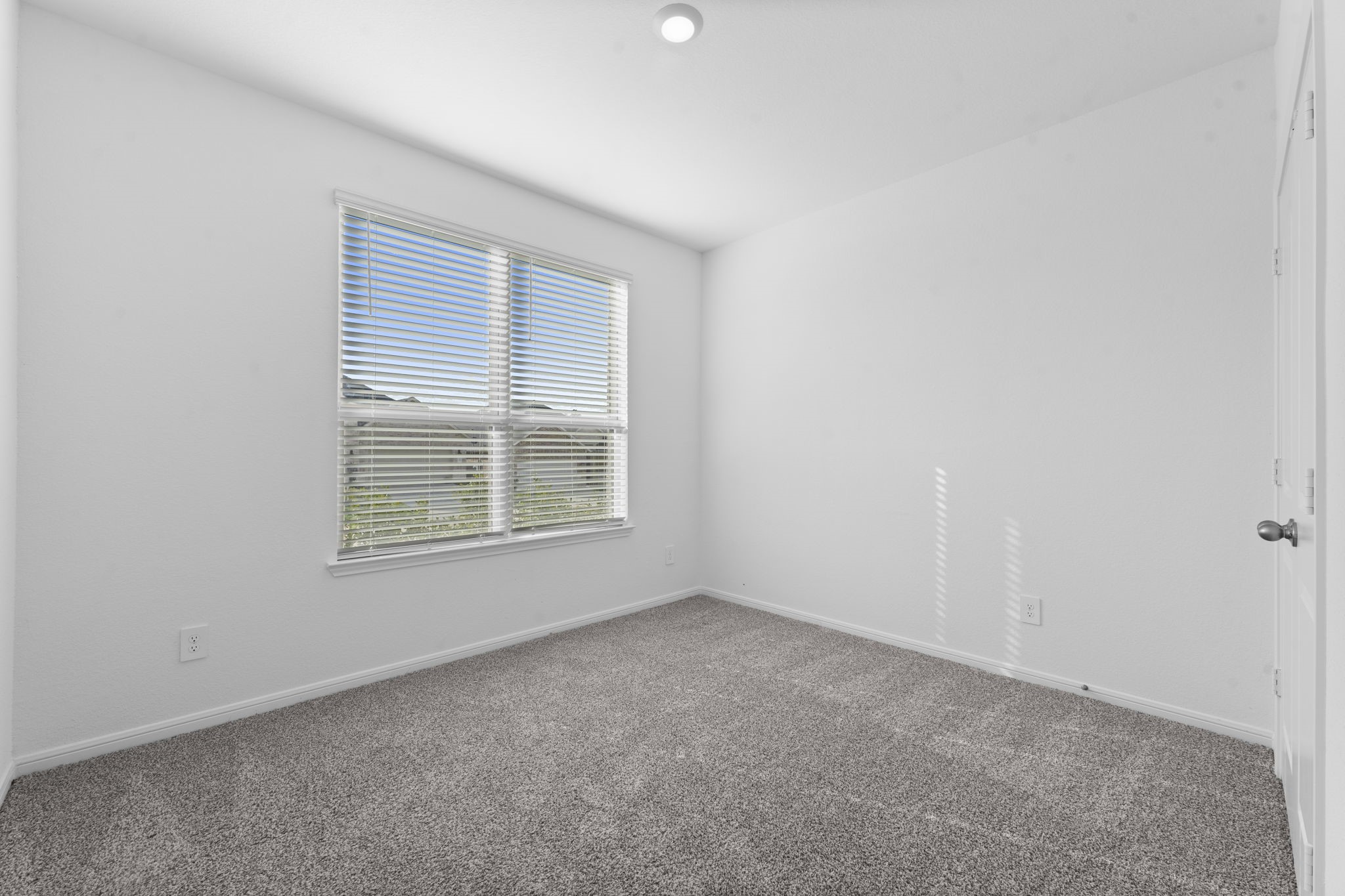 544 Newcomb Hollow Drive Conroe, TX 77304 - Photo 21 of 31 Secondary bedroom located at the front of the home.