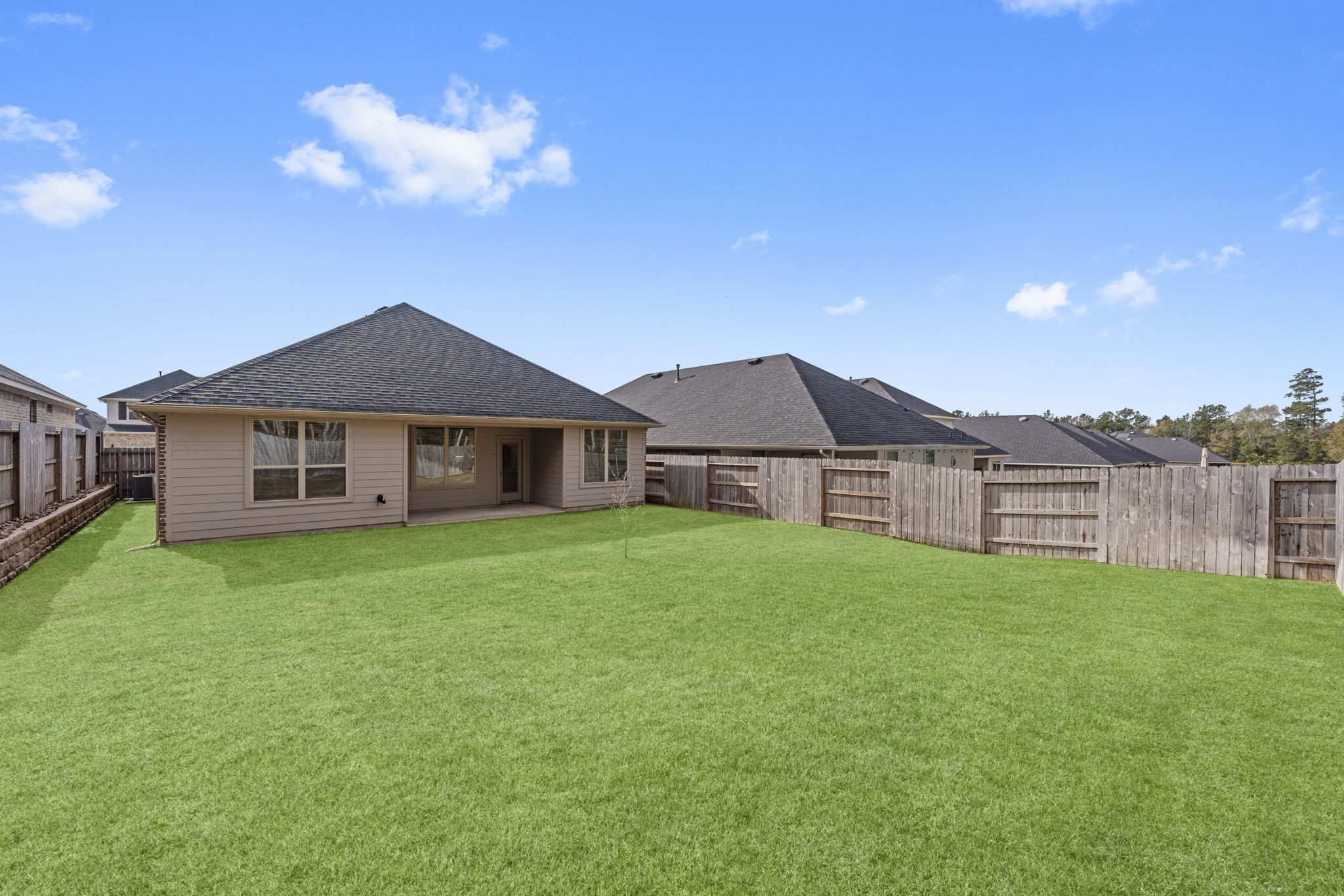 544 Newcomb Hollow Drive Conroe, TX 77304 - Photo 28 of 31 Covered back patio is perfect for relaxing and enjoying the backyard year-round.