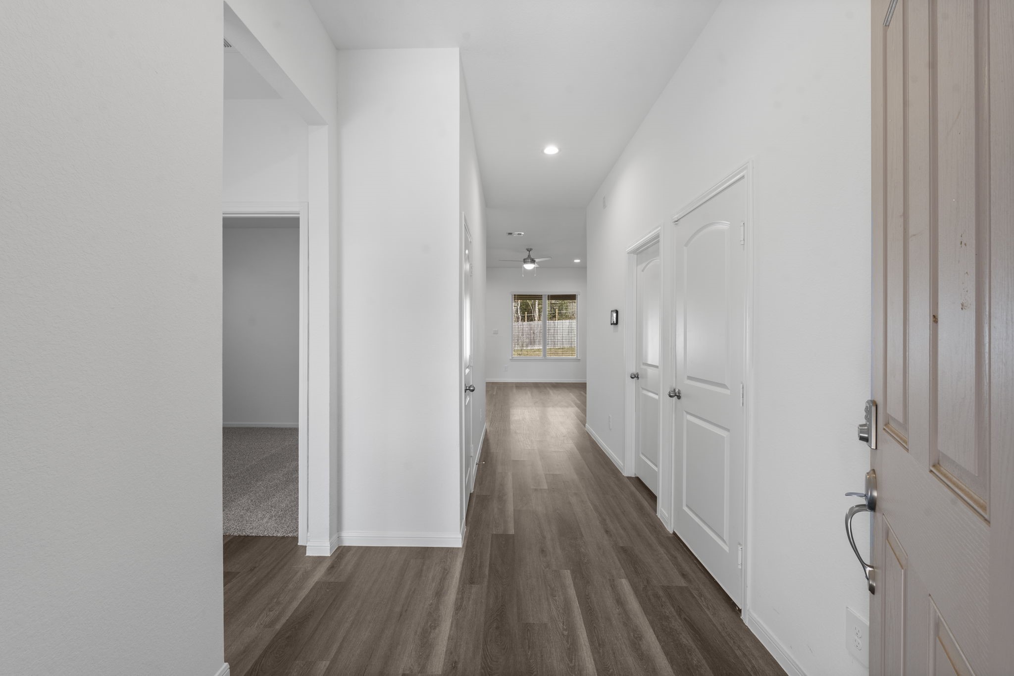 544 Newcomb Hollow Drive Conroe, TX 77304 - Photo 3 of 31 Light and bright entry way. The secondary bedrooms are located on the left. The first door on the right leads to the 2-car garage.