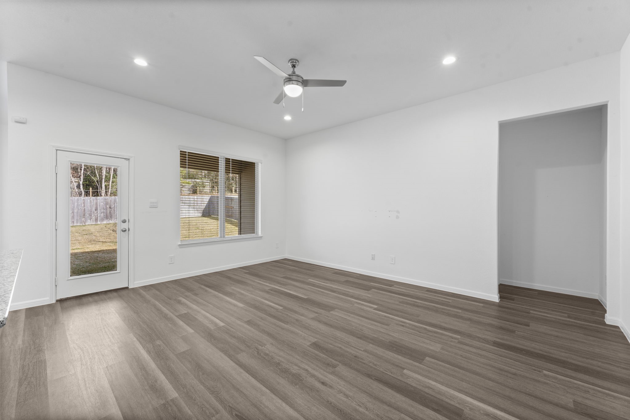 544 Newcomb Hollow Drive Conroe, TX 77304 - Photo 10 of 31 Living room directly off the kitchen offers ample natural light.