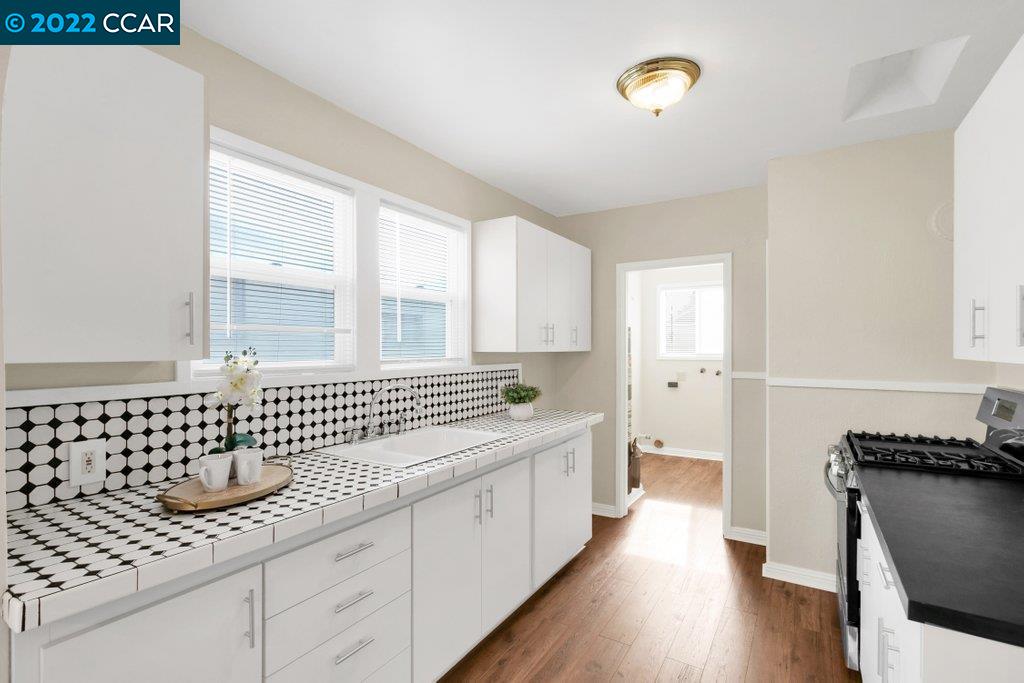 Undisclosed Address Richmond, CA 94801 - Photo 14 of 34 a bathroom with a double vanity sink mirror and bathtub
