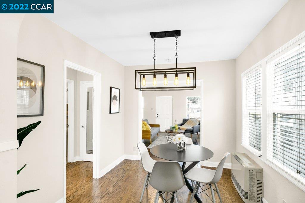 Undisclosed Address Richmond, CA 94801 - Photo 16 of 34 a view of a dining room with furniture window and wooden floor
