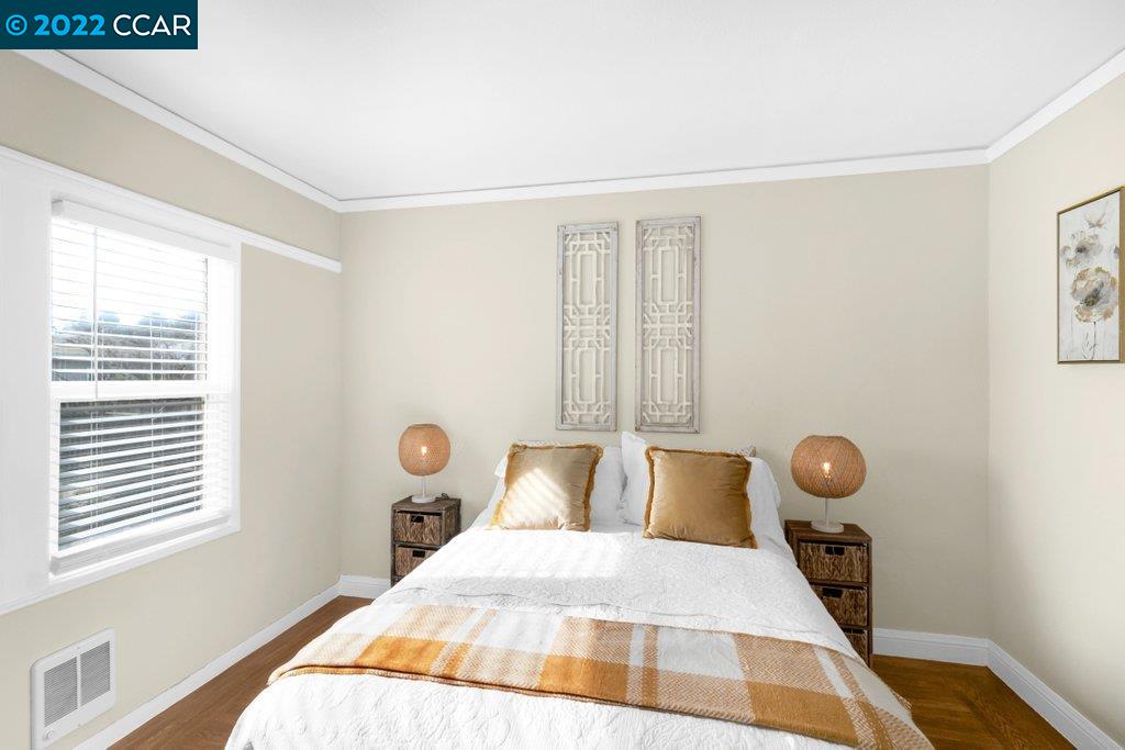 Undisclosed Address Richmond, CA 94801 - Photo 19 of 34 a bedroom with a bed and window