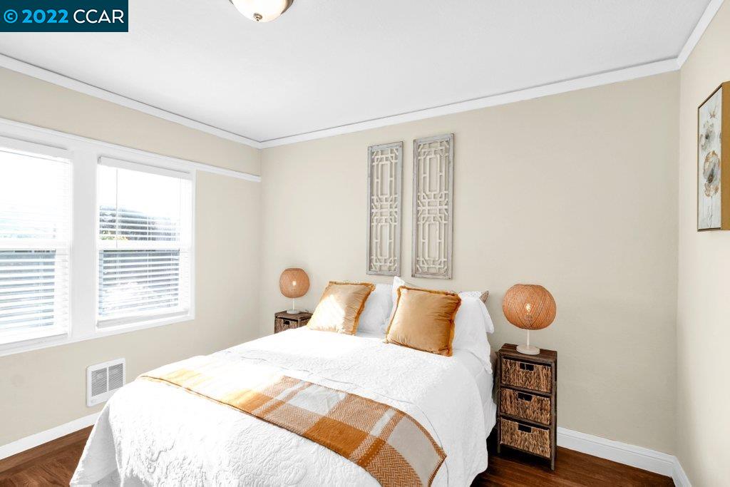 Undisclosed Address Richmond, CA 94801 - Photo 20 of 34 a bedroom with a bed and window