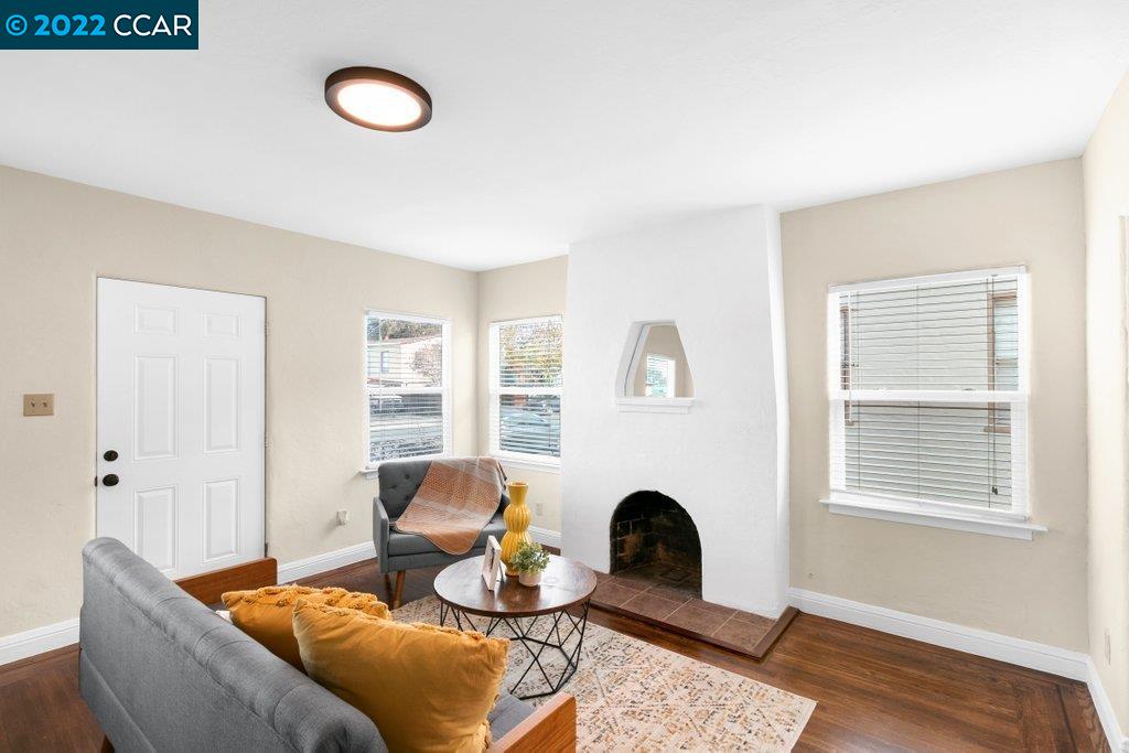 Undisclosed Address Richmond, CA 94801 - Photo 3 of 34 a living room with furniture and a window