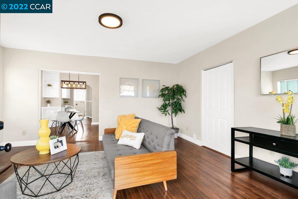 Undisclosed Address Richmond, CA 94801 - Photo 4 of 34 a living room with furniture and wooden floor