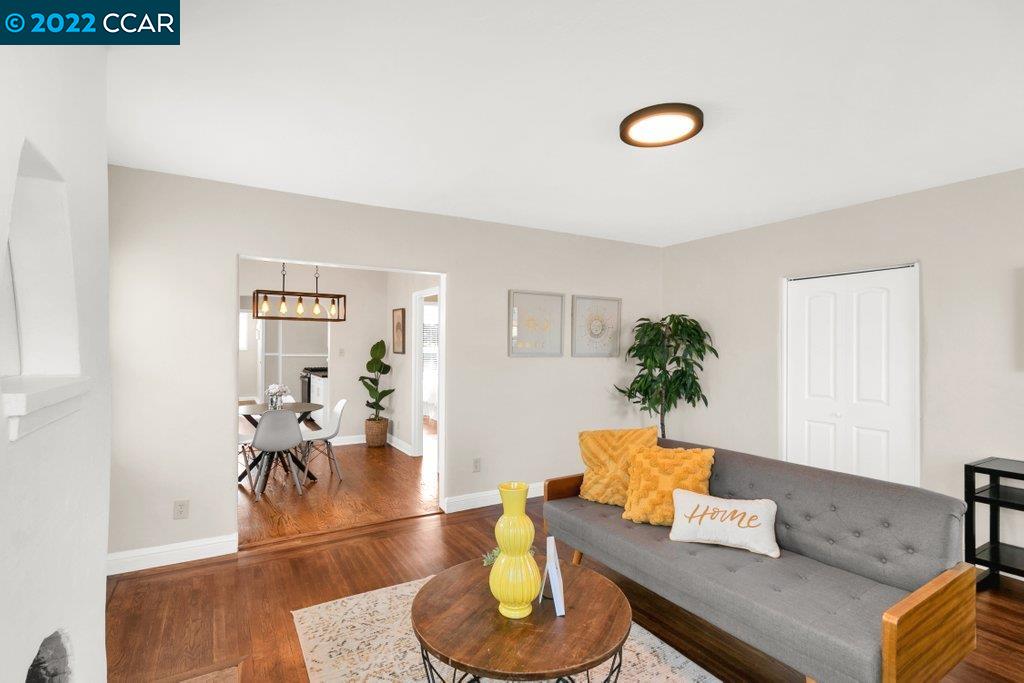 Undisclosed Address Richmond, CA 94801 - Photo 5 of 34 a living room with furniture and a wooden floor