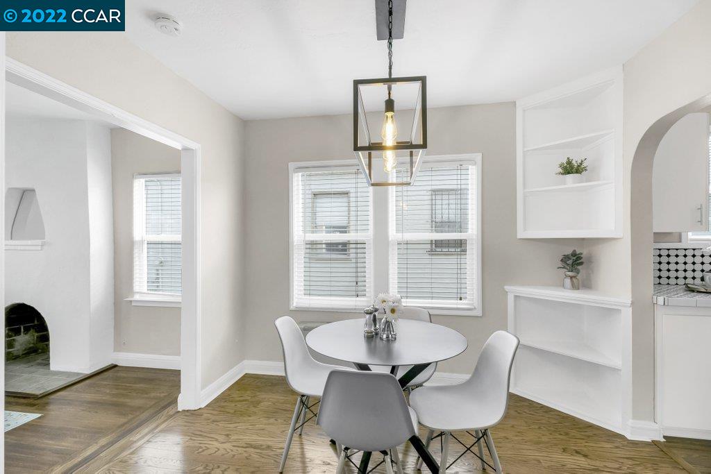 Undisclosed Address Richmond, CA 94801 - Photo 7 of 34 a view of a dining room with furniture window and wooden floor