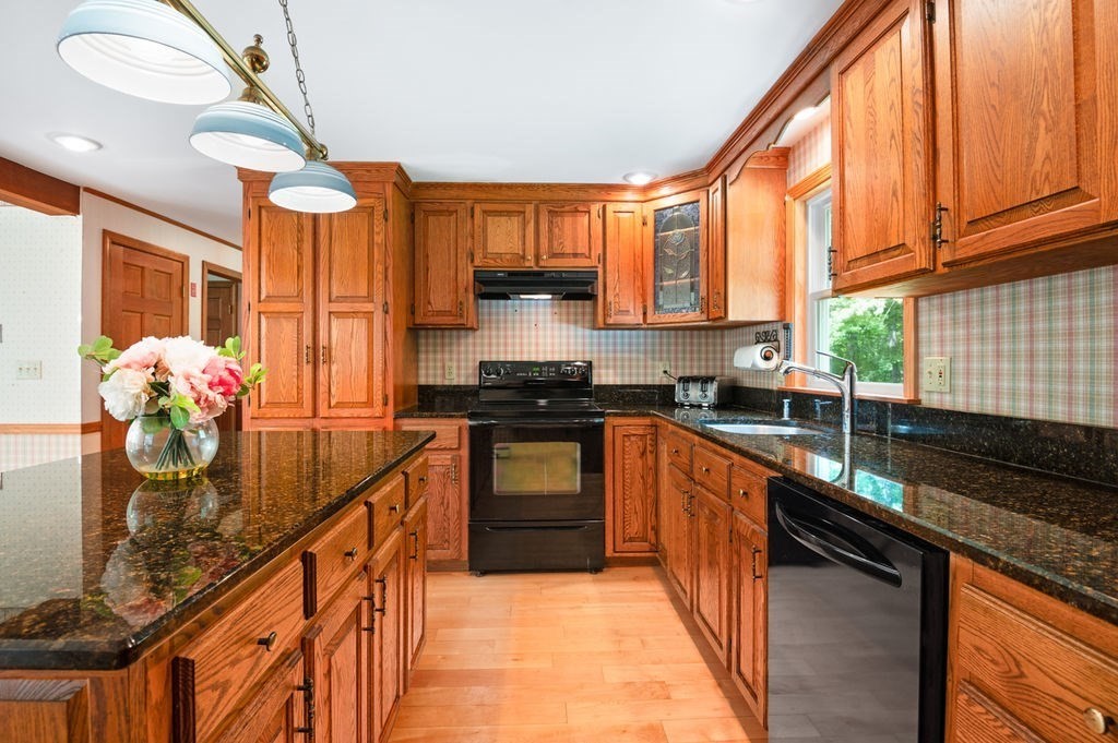 20 Longbrook Road Newbury, MA 01922 - Photo 11 of 41 a kitchen with granite countertop a sink a counter top space appliances and cabinets