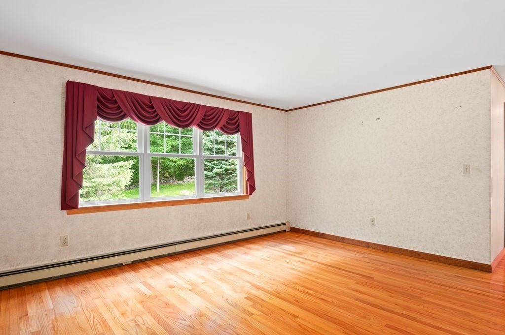20 Longbrook Road Newbury, MA 01922 - Photo 5 of 41 a view of empty room with wooden floor and fan