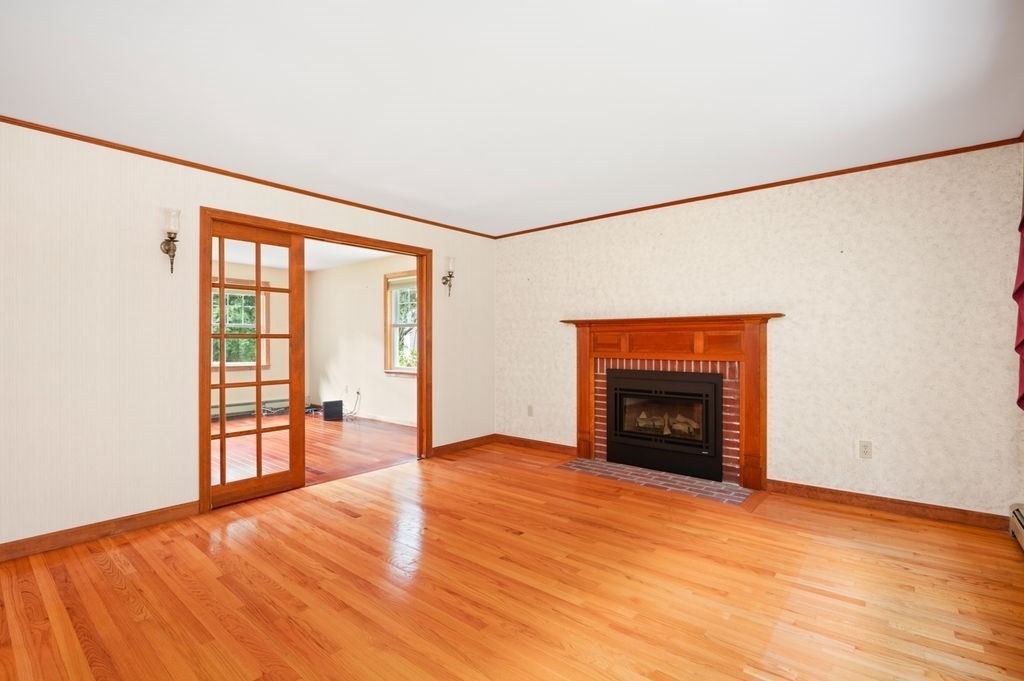 20 Longbrook Road Newbury, MA 01922 - Photo 6 of 41 an empty room with large windows and fireplace