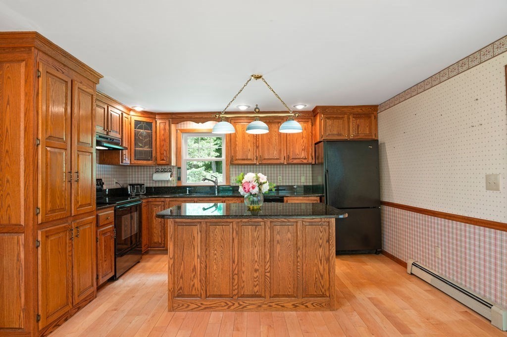 20 Longbrook Road Newbury, MA 01922 - Photo 9 of 41 a kitchen with stainless steel appliances granite countertop a refrigerator and a stove
