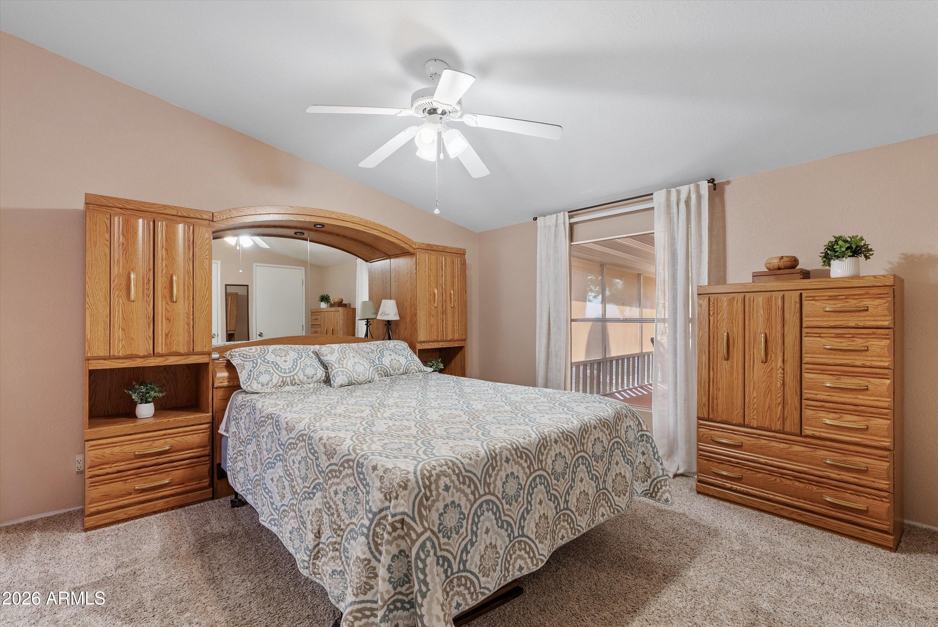 3700 South Tomahawk Road, Unit 91 Apache Junction, AZ 85119 - Photo 14 of 29 a bedroom with a bed and a dresser