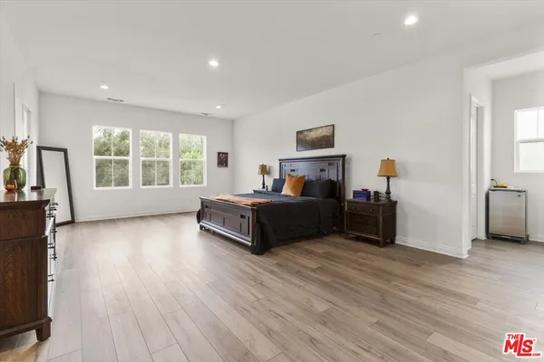 a bedroom with furniture and window