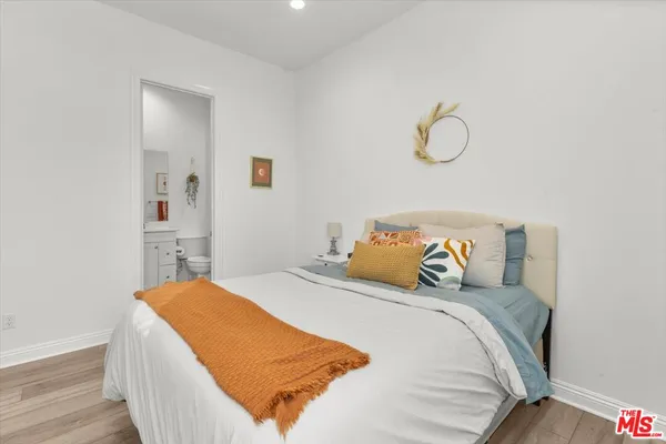 a bedroom with a bed and closet