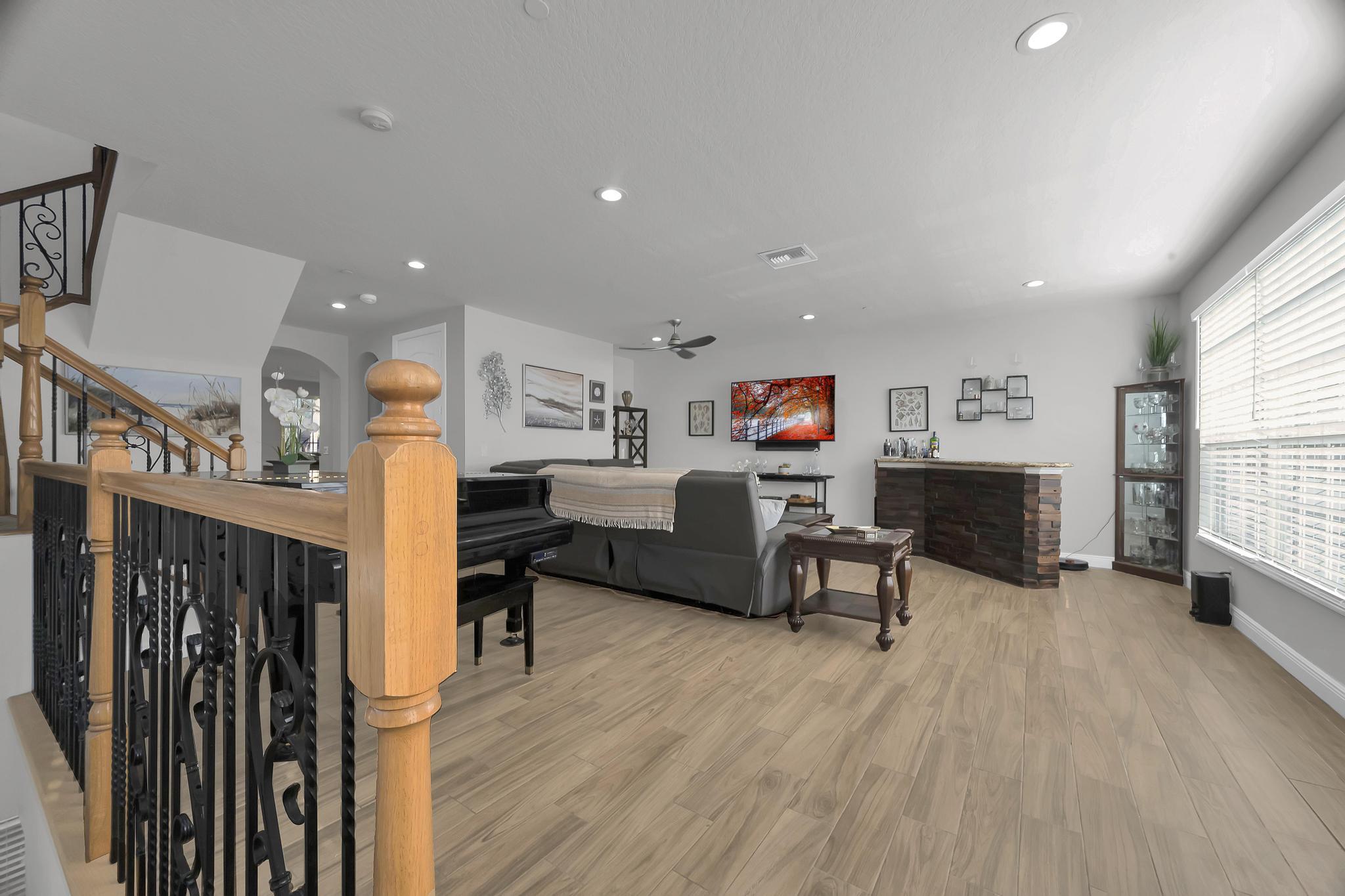 5600 Northeast Trieste Terrace Boca Raton, FL 33487 - Photo 11 of 44 a living room with furniture and a wooden floor
