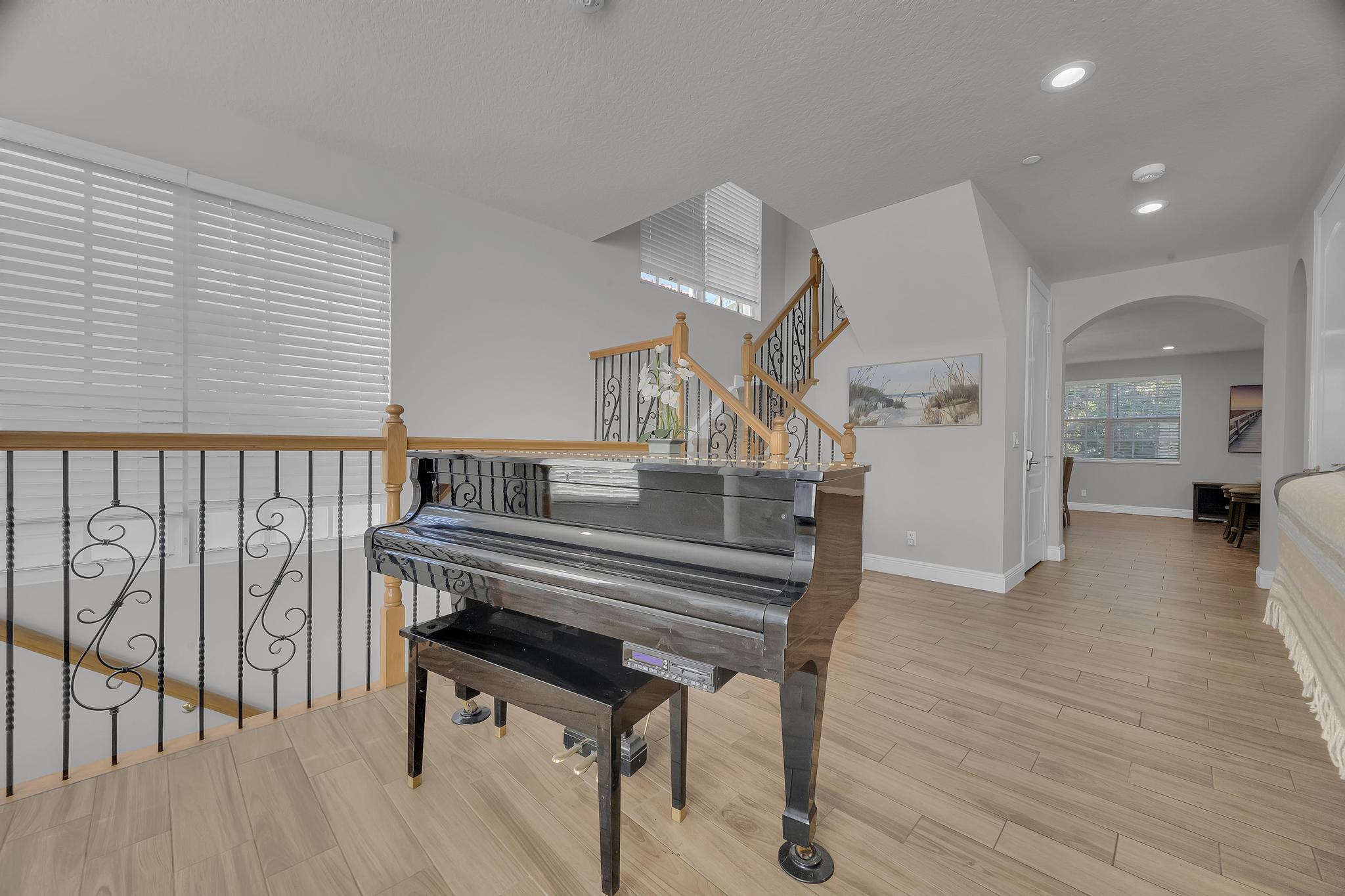5600 Northeast Trieste Terrace Boca Raton, FL 33487 - Photo 12 of 44 a view of entryway and hall with wooden floor
