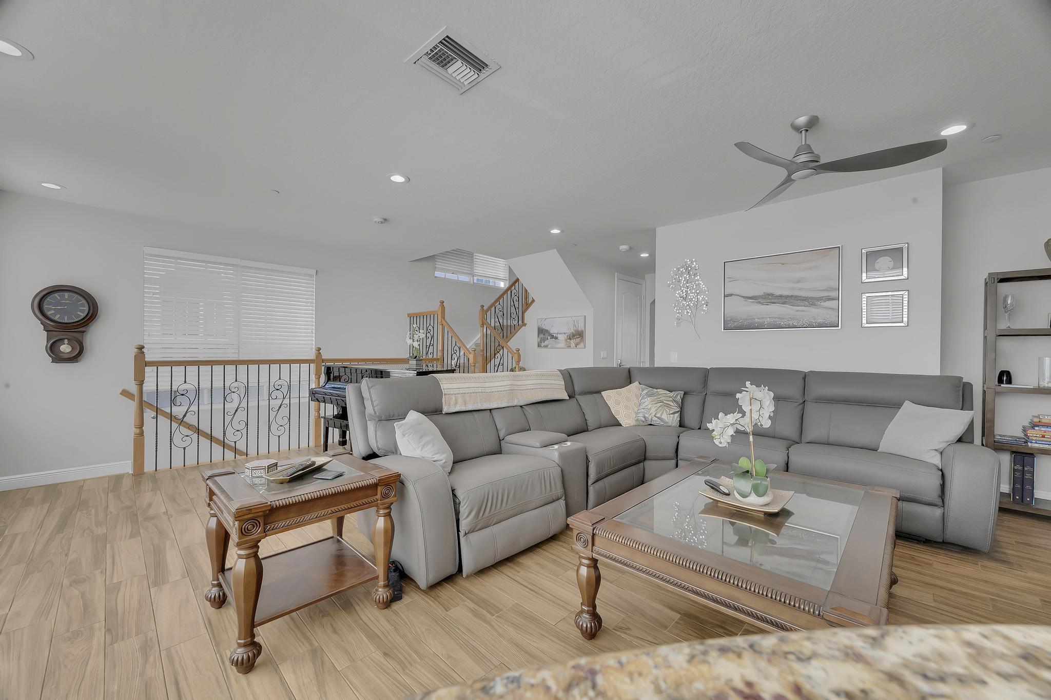 5600 Northeast Trieste Terrace Boca Raton, FL 33487 - Photo 13 of 44 a living room with furniture and a wooden floor