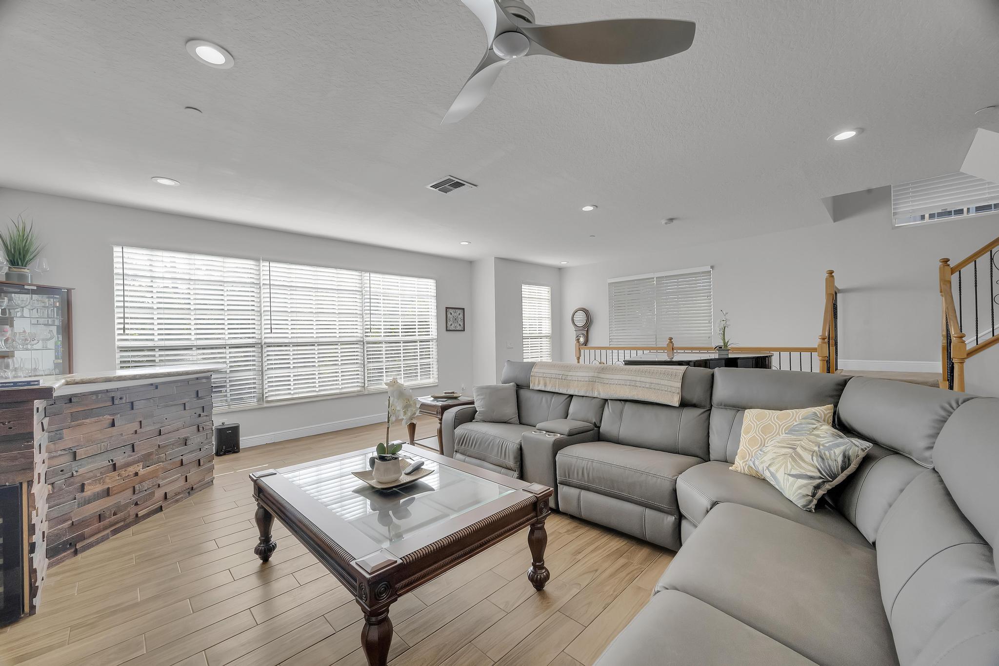 5600 Northeast Trieste Terrace Boca Raton, FL 33487 - Photo 14 of 44 a living room with furniture and a large window