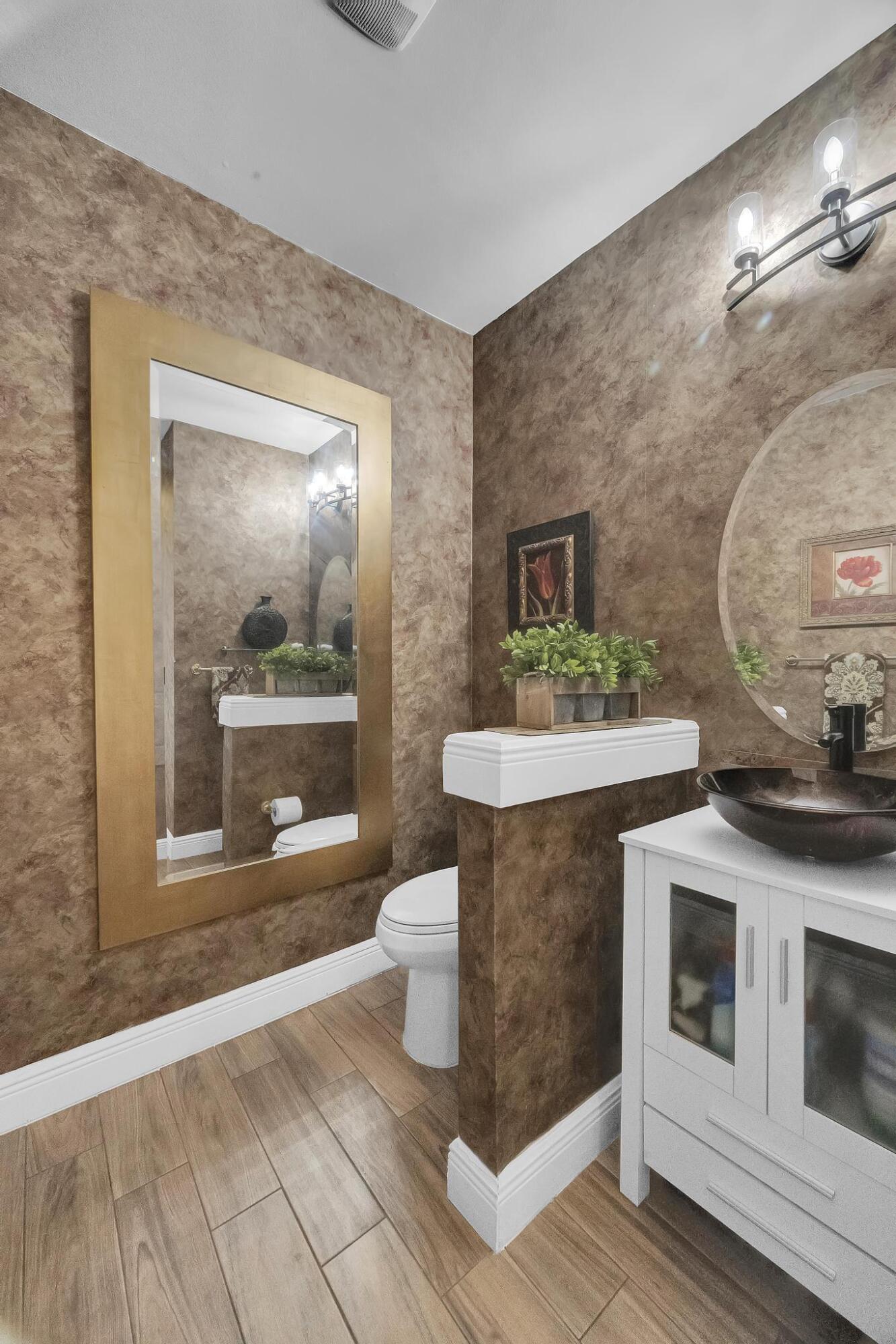 5600 Northeast Trieste Terrace Boca Raton, FL 33487 - Photo 16 of 44 a view of living room with a sink and fireplace