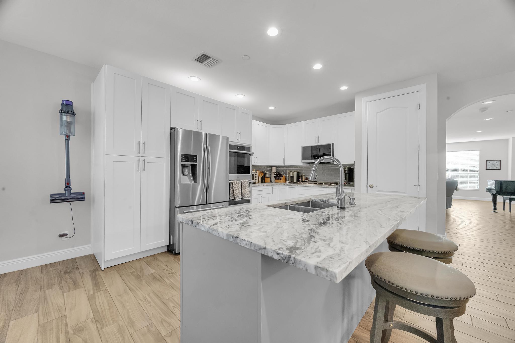 5600 Northeast Trieste Terrace Boca Raton, FL 33487 - Photo 20 of 44 a view of kitchen and kitchen island