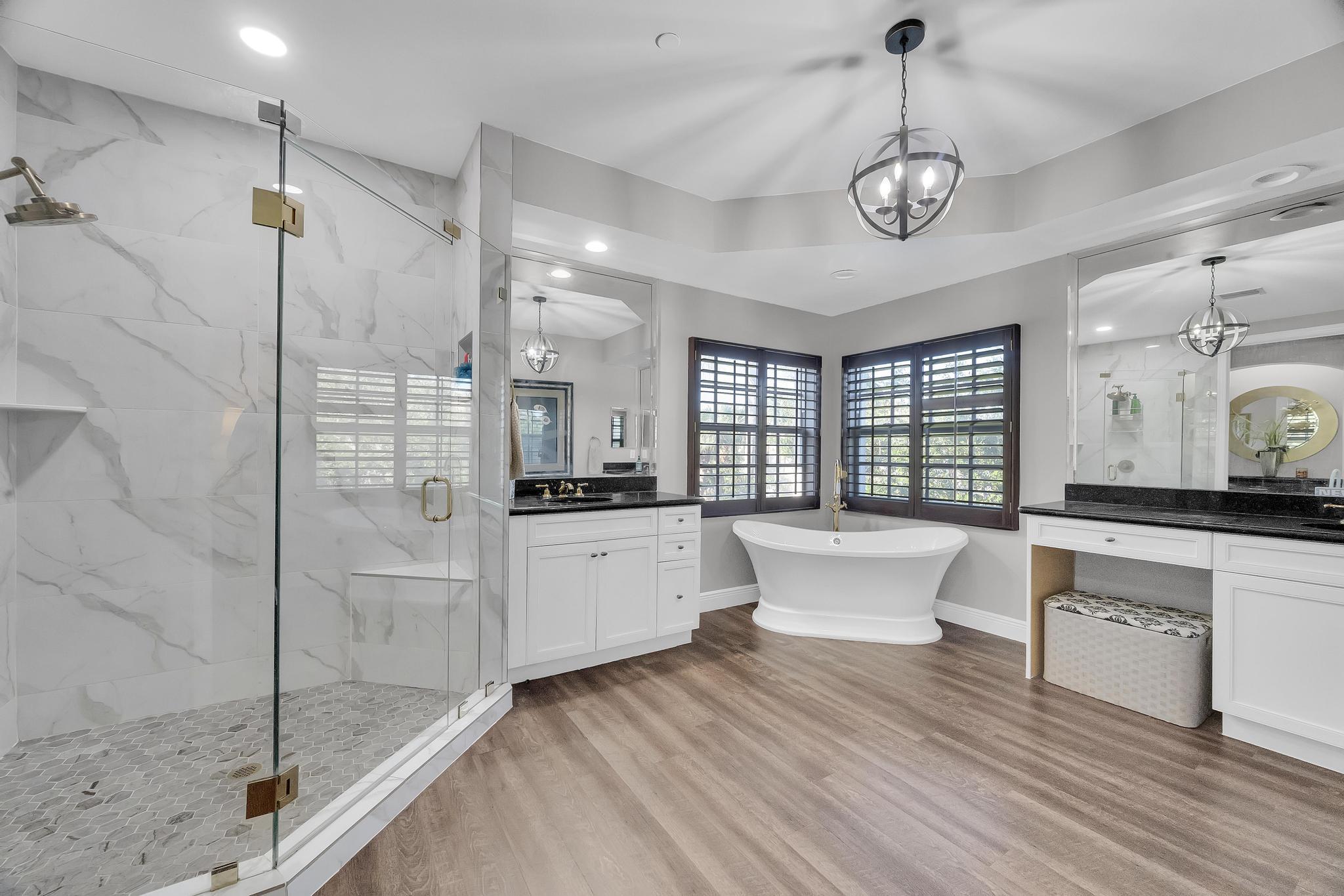 5600 Northeast Trieste Terrace Boca Raton, FL 33487 - Photo 29 of 44 a large white kitchen with a large window