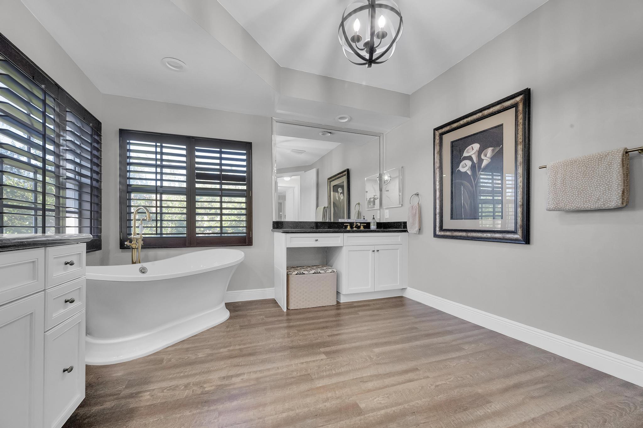 5600 Northeast Trieste Terrace Boca Raton, FL 33487 - Photo 31 of 44 a view of a room with cabinet and windows