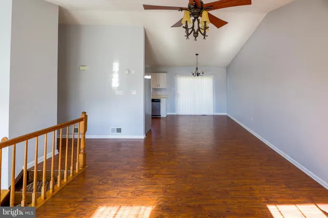 a view of a hallway with a chandelier