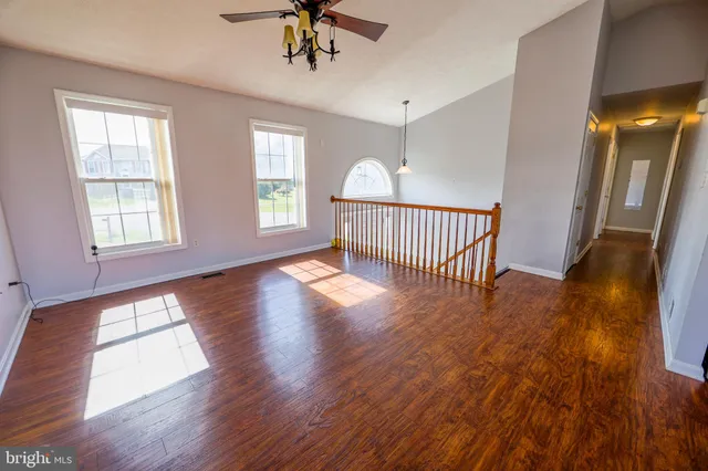 a kitchen with white cabinets stainless steel appliances and sink
