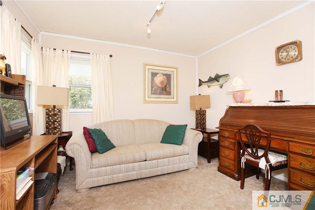 33 Glen Gary Road Middlesex, NJ 08846 - Photo 11 of 25 a living room with furniture and a flat screen tv