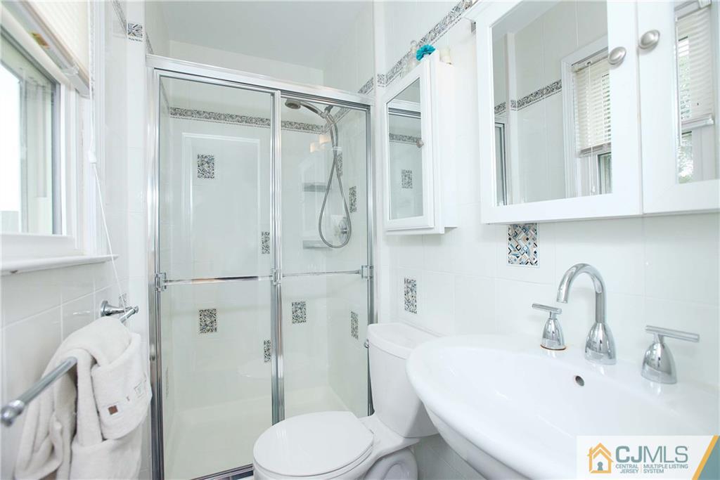 33 Glen Gary Road Middlesex, NJ 08846 - Photo 14 of 25 a bathroom with a sink toilet and shower