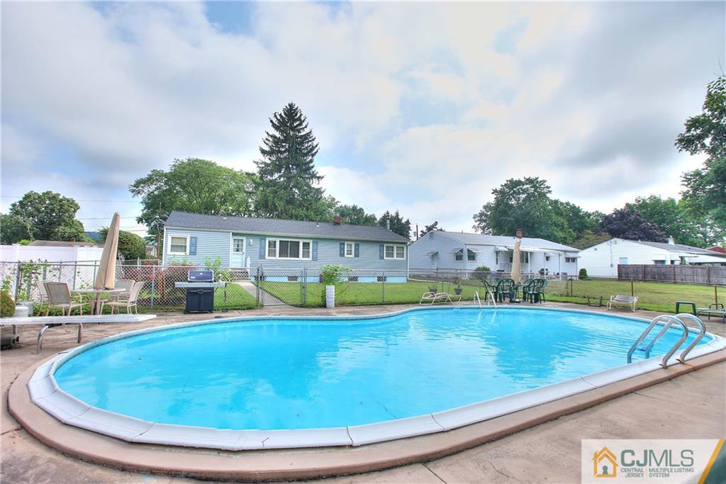 33 Glen Gary Road Middlesex, NJ 08846 - Photo 22 of 25 a view of a swimming pool with a yard