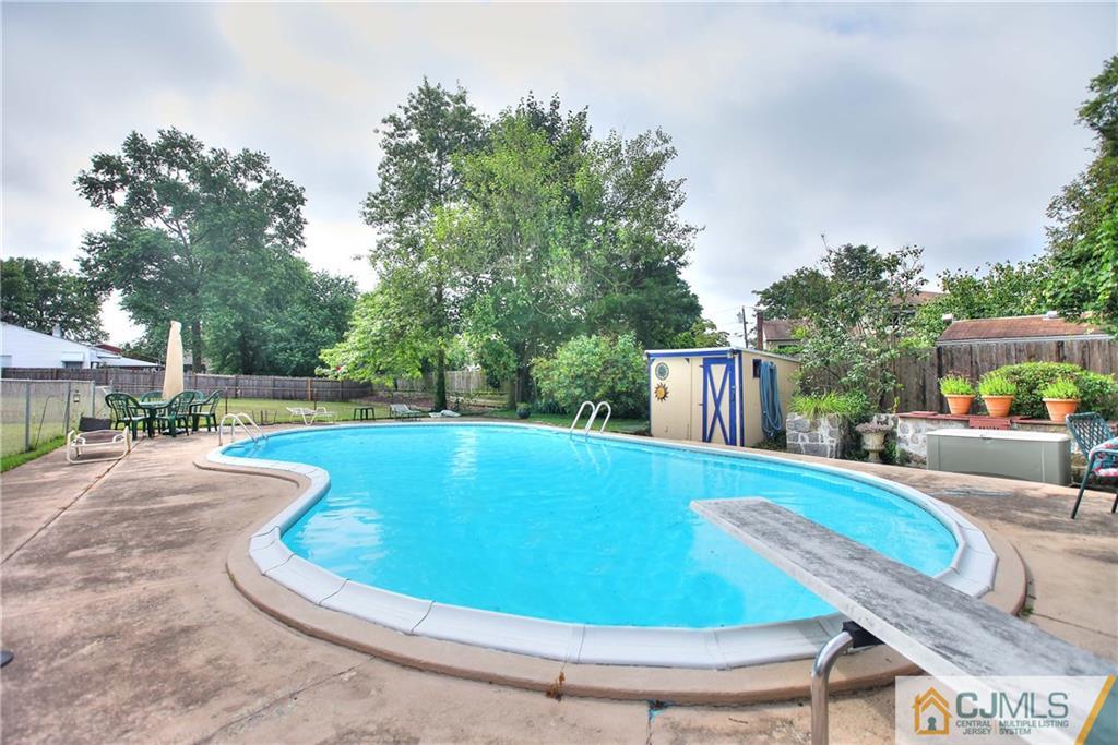 33 Glen Gary Road Middlesex, NJ 08846 - Photo 23 of 25 a view of a swimming pool with a patio