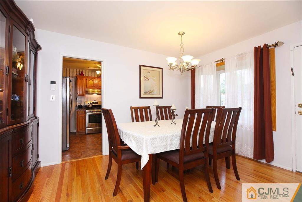 33 Glen Gary Road Middlesex, NJ 08846 - Photo 5 of 25 a view of a dining room with furniture and wooden floor