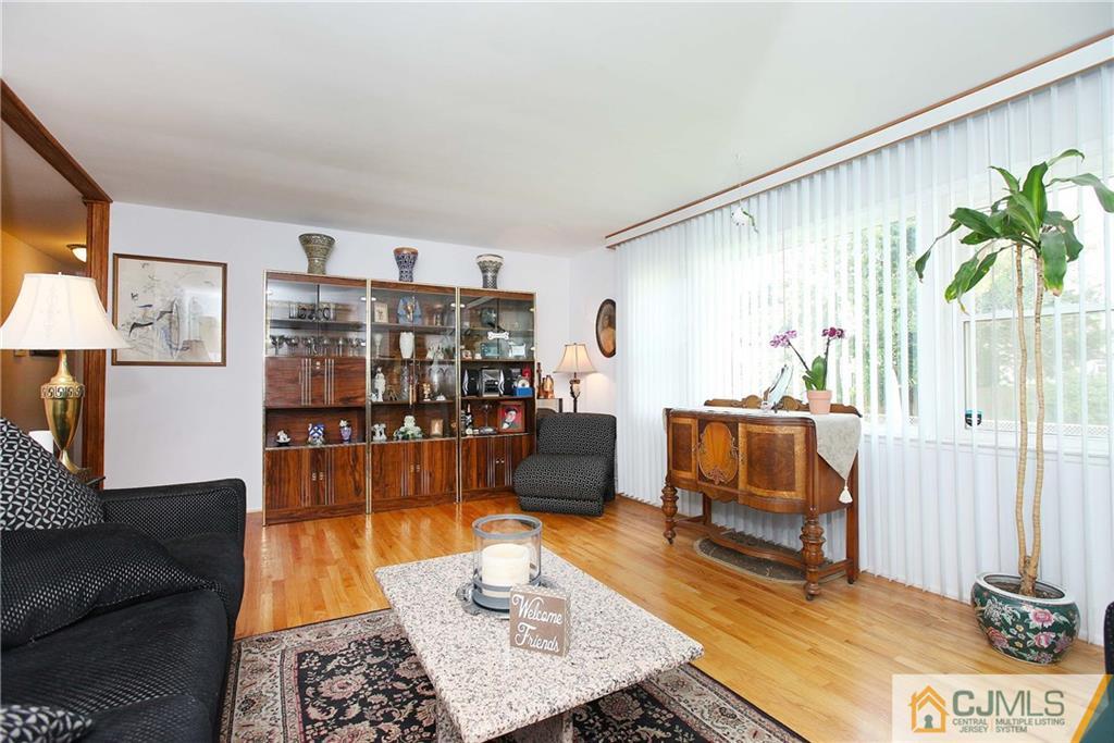 33 Glen Gary Road Middlesex, NJ 08846 - Photo 6 of 25 a living room with furniture and a lamp