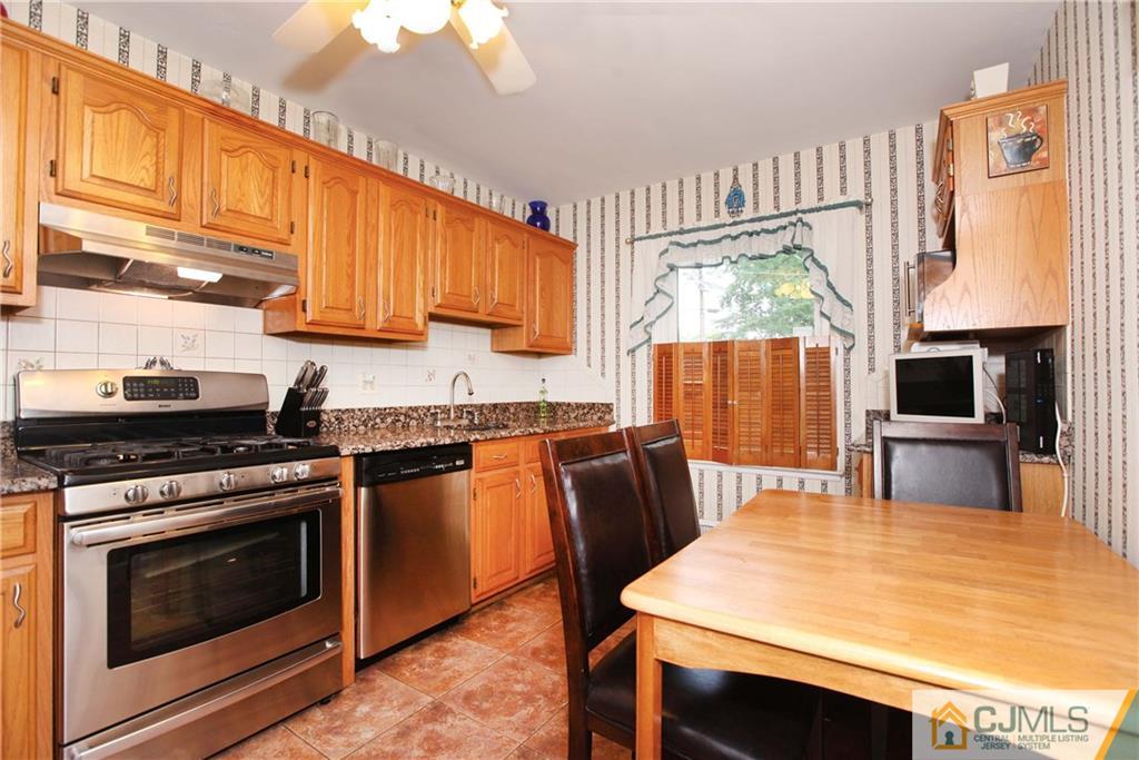 33 Glen Gary Road Middlesex, NJ 08846 - Photo 10 of 25 a kitchen with stainless steel appliances a stove a sink dishwasher and cabinets