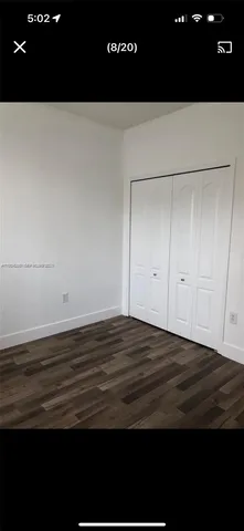 a view of room and wooden floor