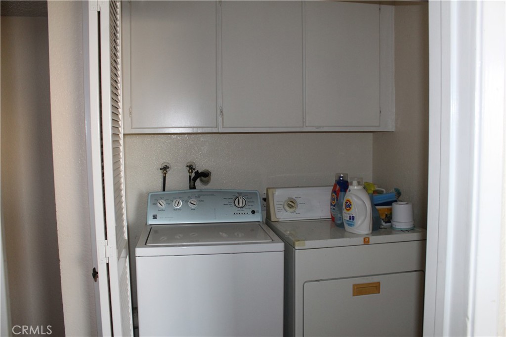 12141 Centralia Street, Unit 119 Lakewood, CA 90715 - Photo 11 of 31 a utility room with dryer and washer