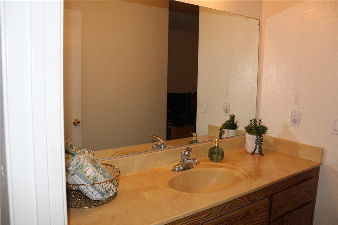 12141 Centralia Street, Unit 119 Lakewood, CA 90715 - Photo 17 of 31 a bathroom with a sink and a mirror