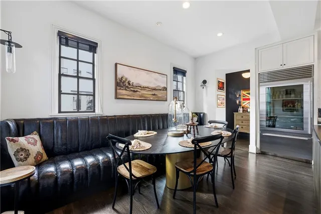 a view of a livingroom with furniture and workspace