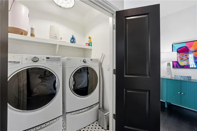 a bed room with a bed a television and a dresser