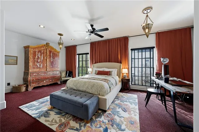 a room with a walk in closet and wooden floor